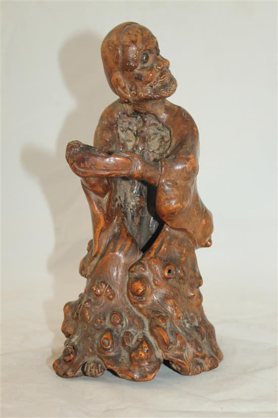 A Chinese rootwood carving of a luohan, 18th century, 23cm